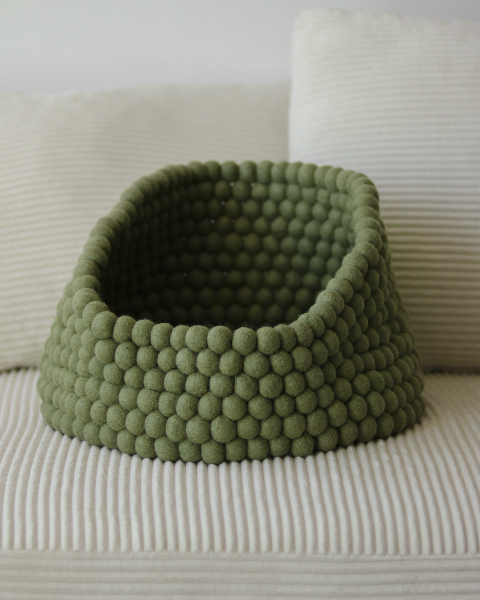 Noots Coco felt ball pet bed in matcha green