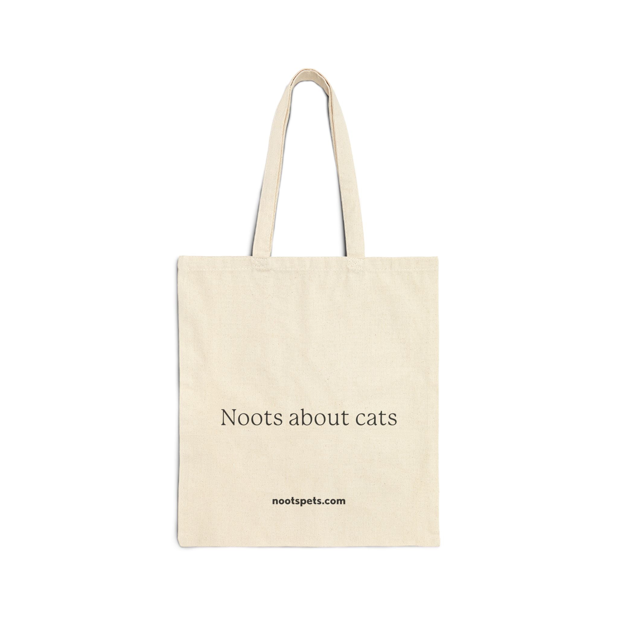 tan canvas tote bag with 'Noots about cats' text